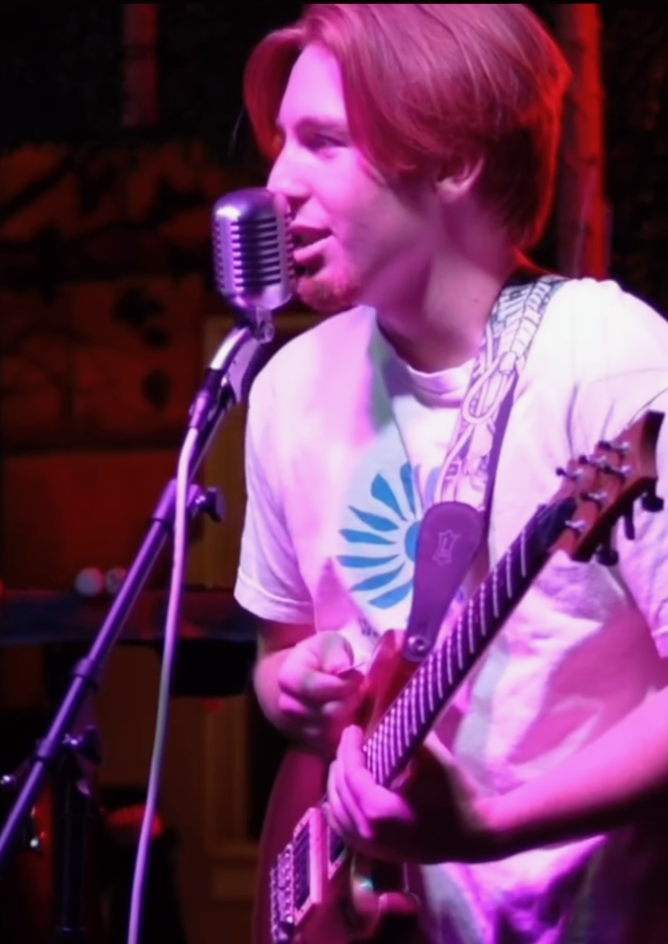 Singer guitarist close-up on stage